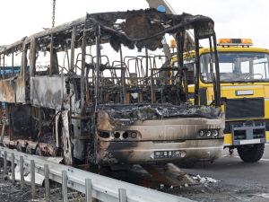 Burned Coach Bus Highway Recovery Assistance. Shutterstock 20 burnt to death in deadly bus fire in India’s Rajasthan