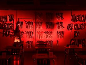 Jenni Boelkens adds tally marks to a wall in the Parkland 17 exhibition at the Standard Hotel in Los Angeles, California on April 11, 2018, to total 96 for the average number of Americans killed everyday by guns. AFP US marshal and undocumented immigrant wounded in Los Angeles shootout