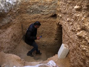 A local descends into an underground trench while guiding journalists visiting the Palmyra Prison Complex formerly used by the ousted Assad government in Syria's central city of Palmyra on February 7, 2025. (Photo by OMAR HAJ KADOUR / AFP) underground prison found in Homs