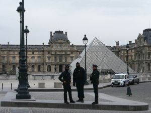 French police officers stand in front of the Louvre Museum after robbery, in Paris on October 19, 2025. Photo by DIMITAR DILKOFF / AFP Louvre Museum