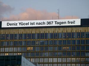 An inscription reading "Deniz Yucel is free after 367 days!" is seen on the top of the headquarters of German newspaper "Die Welt" on Feb. 16, 2018 in Berlin, after Turkey released German-Turkish journalist Deniz Yucel from prison. Turkey has released Deniz Yucel from prison after more than one year behind bars. His incarceration has been the biggest stumbling block to rebuilding badly damaged ties between the governments of German Chancellor and Turkish President. (Stefanie LOOS / AFP)