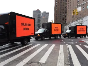 Inspired by the Oscar-nominated film "Three Billboards Outside Ebbing, Missouri", billboards on a truck circle the United Nations on Feb. 22, 2018 for three hours to demand action on Syria in advance of a Security Council vote in New York. 
(TIMOTHY A. CLARY / AFP)