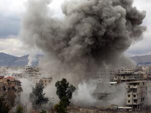 Smoke billows following Syrian government bombardments on Kafr Batna, in the besieged Eastern Ghouta region on the outskirts of the capital Damascus on Feb. 22, 2018. 
(AMER ALMOHIBANY / AFP)