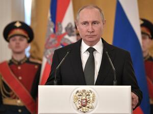 Russian President Vladimir Putin (C) delivers a speech during a ceremony to present national award and to mark the Defender of the Fatherland Day at the Kremlin in Moscow on Feb. 23, 2018. 
(Alexey NIKOLSKY / Sputnik / AFP)