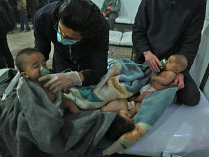 Syrian babies receive treatment for a suspected chemical attack at a makeshift clinic on the rebel-held village of al-Shifuniyah in the Eastern Ghouta region on the outskirts of the capital Damascus (AFP)