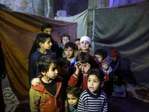 Children in basement used as makeshift bomb shelter in Eastern Ghouta (AFP/File Photo)	