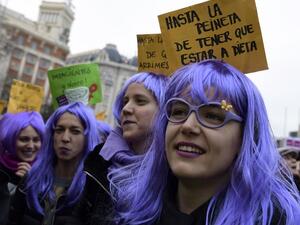Woman sporting wigs attend a demonstration to defend women's rights on International Women's Day in Madrid, on Mar. 8, 2018. Spain celebrated International Women's Day today with an unprecedented general strike in defense of their rights that saw hundreds of trains cancelled and countless protests scheduled throughout the day.
(OSCAR DEL POZO / AFP)