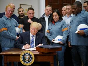U.S. President Donald Trump signs Section 232 Proclamations on Steel and Aluminum Imports in the Oval Office of the White House on Mar. 8, 2018, in Washington, DC. Trump on Thursday declared the American steel and aluminum industries had been "ravaged by aggressive foreign trade practices" as he signed off on contentious trade tariffs. "It's really an assault on our country," he continued. "I've been talking about this a long time, a lot longer than my political career."
(MANDEL NGAN / AFP)