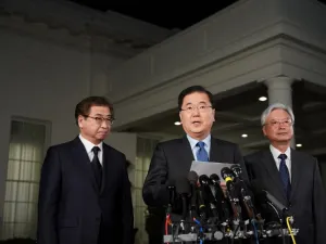 South Korean National Security Advisor Chung Eui-yong (C), flanked by South Korea National Intelligence Service chief Suh Hoon (L) and South Korea's ambassador to the United States Cho Yoon-je (R), briefs reporters outside the West Wing of the White House on Mar. 8, 2018 in Washington, DC, announcing North Korean leader Kim Jong Un has offered to meet U.S. President Donald Trump. 
(MANDEL NGAN / AFP)