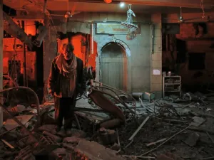 A man walks inside a mosque after an air strike in Douma, Eastern Ghouta, on Mar.19, 2018. The regime did not completely release the pressure on Douma however, the latest strikes killing at least 13 people overnight, the Syrian Observatory for Human Rights said. (HASAN MOHAMED / AFP)