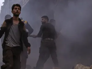 Members of the Syrian civil defense search for survivors in the aftermath of an air strike in the rebel-held town of Harem in the northwestern Idlib province on Mar. 22, 2018. 
(Aaref WATAD / AFP)