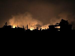 A picture taken early on Mar. 23, 2018 shows flames erupting following regime bombardment in Douma, one of the few remaining rebel-held pockets in Eastern Ghouta on the outskirts of the capital Damascus. 
(HAMZA AL-AJWEH / AFP)
