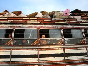 Buses carrying Jaish al-Islam fighters and their families from their former rebel bastion of Douma, arrive at the Abu al-Zindeen checkpoint controlled by Turkish-backed rebel fighters near the northern Syrian town of al-Bab, on Apr. 12, 2018. Rebels in Syria's Eastern Ghouta surrendered their heavy weapons and their leader left the enclave, a monitor said, signalling the end of one of the bloodiest assaults of Syria's seven-year war. (Nazeer al-Khatib / AFP)