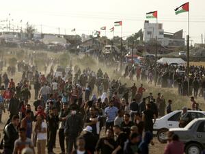 Palestinians gather to protest near the Israeli border fence, east of Gaza City in the central Gaza Strip on Apr. 13, 2018. Several thousand Gazans gathered for a third consecutive Friday of mass protests along the border with Israel after violence in which Israeli forces have killed 33 Palestinians and wounded hundreds of others.
(MAHMUD HAMS / AFP)