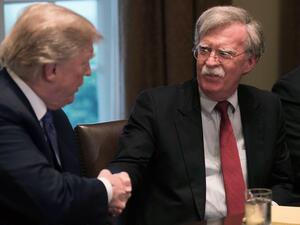 (FILES) In this file photo taken on Apr. 9, 2018 US President Donald Trump shakes hands with National Security Advisor John Bolton during a meeting with senior military leaders at the White House in Washington, DC. Trump has not decided whether or not to scrap the Iran nuclear deal, Bolton said on April 29, 2018. "He has made no decision on the nuclear deal, whether to stay in or get out," Bolton told Fox News Sunday.

(NICHOLAS KAMM / AFP)