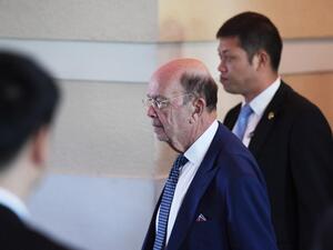 US Commerce Secretary Wilbur Ross (C) walks through a hotel lobby as he heads to the US embassy in Beijing on May 3, 2018. Top US and Chinese officials prepared on May 3 to kick off crucial trade talks in Beijing but both sides sought to dampen expectations for a quick resolution to a heated dispute between the world's two largest economies.
(GREG BAKER / AFP)