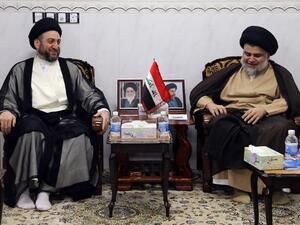 Iraqi Shiite Muslim leader and head of Hikma party Ammar al-Hakim (L) and Shiite cleric Moqtada Sadr meet in the Iraqi holy city of Najaf on May 17, 2018. Iran and its allies were mustering a bid to limit the role of fiery Shiite cleric Moqtada Sadr in Iraq's next government after his shock election win reshaped the country's political landscape. (Haidar HAMDANI / AFP)