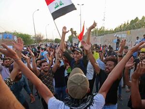 Iraqi men demonstrate in the southern oil-rich city of Basra, the heart of recent protests against power shortages, graft and other social ills, on August 10, 2018. (AFP/ File)