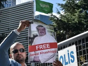 A protester holds a picture of missing journalist Jamal Khashoggi during a demonstration in front of the Saudi Arabian consulate, on October 5, 2018, in Istanbul. (AFP PHOTO / OZAN KOSE)
