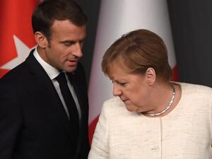 French President Emmanuel Macron (L) and German Chancellor Angela Merkel (AFP)