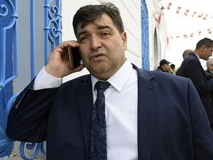 Rene Trabelsi speaks on the phone outside the Ghriba Synagogue on the Tunisian resort island of Djerba. (FETHI BELAID / AFP)