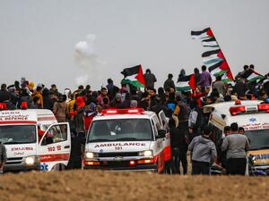 This picture taken on December 7, 2018 shows ambulances parked as Palestinians gather for a demonstration along the border with Israel east of Gaza City. (Said KHATIB / AFP)