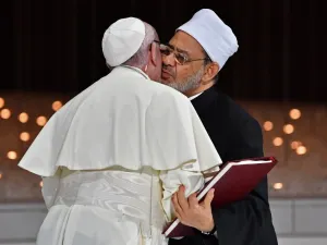 Pope Francis (L) and Egypt's Azhar Grand Imam Sheikh Ahmed al-Tayeb greet each other as they exchange documents during the Human Fraternity Meeting at the Founders Memorial in Abu Dhabi on February 4, 2019. 
Vincenzo PINTO / AFP