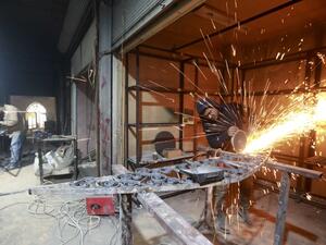 Labourers take part in restoration work at the Saqatiya market in the old quarter of Syria's second city of Aleppo  (AFP)
