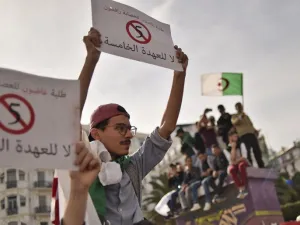 Algerian students hold up banners as they demonstrate in the capital Algiers on March 5, 2019 against their ailing president's bid for a fifth term. (AFP)