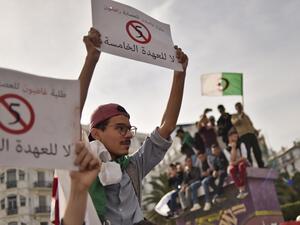 Algerian students hold up banners as they demonstrate in the capital Algiers on March 5, 2019 against their ailing president's bid for a fifth term. (AFP)