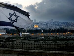 An Israeli flag flutters at Mount of Olives with the Old City of Jerusalem and its Dome of the Rock mosque in the centre, March 27, 2019. (THOMAS COEX / AFP)
