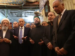 Lebanese Parliament Speaker Nabih Berri (2nd-L) prays at the shrine of Imam al-Abbas in the central Iraqi holy city of Karbala on April 2, 2019. 
Mohammed SAWAF / AFP