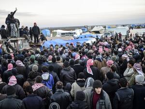 Syrians fleeing the northern embattled city of Aleppo wait on February 5, 2016 in Bab-Al Salama, next to the city of Azaz, northern Syria. (AFP/Bulent Kilic)