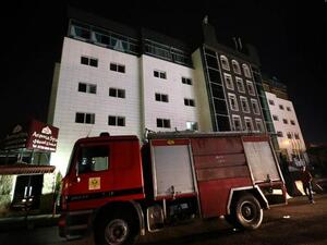 Iraqi firemen work at four-star Capitol Hotel in Arbil, the capital of the autonomous Kurdish region of northern Iraq, on February 5, 2016. (AFP/Safin Hamed)