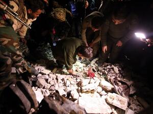 Syrian government security forces inspect the site of a series of attacks the area of the Sayyida Zeinab shrine south of Syria's capital Damascus on February 21, 2016. (AFP/Youssef Karwashan)