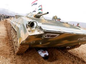 Syrian volunteers take part in paramilitary training conducted by the Syrian army in al-Qtaifeh, 50 kms north of the capital Damascus on February 22, 2016. (AFP/Louai Beshara)