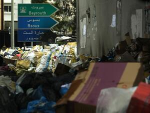 Road signs stand in the middle of a temporary garbage dump in the area of Jamhour, east of the Lebanese capital Beirut, on March 15, 2016. (AFP/Patrick Baz)