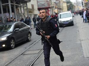 A Turkish policeman runs after an explosion on the pedestrian Istiklal avenue in Istanbul on March 19, 2016. Two people, including the bomber, were killed and six others injured in a suicide attack on a major shopping street in Istanbul on Saturday, Turkey's CNN-Turk television reported. (AFP/File)
Bulent KILIC / AFP