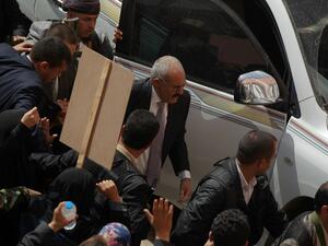 Former Yemeni president Ali Abdullah Saleh is surrounded by his security personnel during a demonstration against the Saudi-led coalition, commemorating one year of the alliance's military campaign against insurgents on March 26, 2016 next to the Monument to the Unknown Soldier in the Yemeni capital Sanaa. (AFP/Muhammad Huwais)