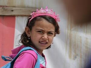A Syrian refugee girl heads to school at an unofficial refugee camp in Lebanon (AFP/File Photo)	