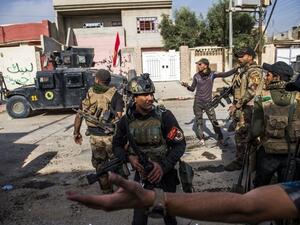  Iraqi Special Forces on a raid (AFP/File Photo)	
