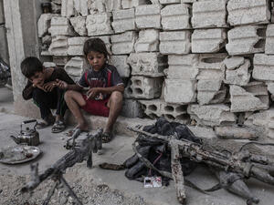 Children look at seized weapons (AFP/File Photo)