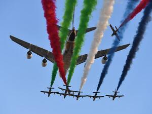 Aermacchi MB-339 jets from UAE's Al-Fursan display team perform with an Etihad Airways' Airbus A380 before the start of the Abu Dhabi Formula One Grand Prix at the Yas Marina circuit on Nov. 26, 2017. 

(Andrej ISAKOVIC / AFP)