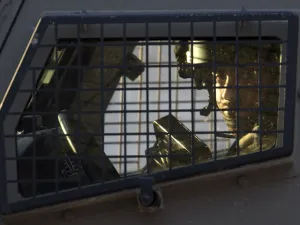A member of the Israeli forces is seen inside a vehicle during a military operation in Jenin, in the north of the occupied West Bank, on January 18, 2018. A Palestinian was killed during clashes with Israeli forces in Jenin, the Palestinian health ministry announced. Israel's Shin Beth security services said shots were fired during a raid by border guards to capture the alleged perpetrators of an attack earlier this month in which a rabbi was shot dead. 
(JAAFAR ASHTIYEH / AFP)