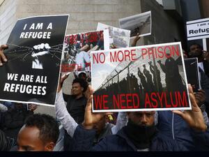 African migrants demonstrate against the Israeli government's policy to forcibly deport African refugees and asylum seekers from Israel to Uganda and Rwanda, outside the Rwanda embassy on Jan. 22, 2018 in the Israeli city of Herzliya (JACK GUEZ / AFP)
