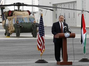 U.S. embassy charge d'affaires Henry Wooster delivers a speach in front of a Black Hawk helicopter during a handing over ceremony at the King Abdullah II Air Base in Zarqa on Jan. 28, 2018 (STRINGER / AFP)