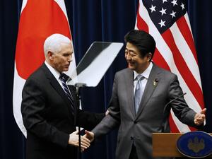 U.S. Vice President Mike Pence (L) and Japan's Prime Minister Shinzo Abe shake hands during their joint announcement after their meeting at Abe's official residence in Tokyo on Feb. 7, 2018 (TORU HANAI / POOL / AFP)