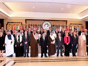 Kuwaiti Foreign Minister Sheikh Sabah al-Khaled al-Sabah (C) stands next to Iraq Prime Minister Haider al-Abadi, EU Foreign Policy Chief Frederica Mogherini, U.N. Secretary-General Antonio Guterres as they pose with other officials for a group photo on the second day of an international conference for reconstruction of Iraq , in Kuwait City, on Feb. 14, 2018 (YASSER AL-ZAYYAT / AFP)