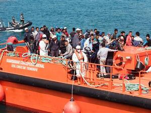 Would-be immigrants stand on the Salvamar Guardamar C. Arenal vessel as they arrive in the port of Tarifa following their rescue by salvage vessels off the Strait of Gibraltar coast, on June 23, 2017 (AFP/File)