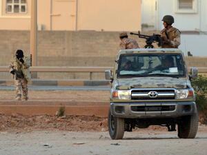Libyans loyal to the LNA patrolling Benghazi in 2014. (AFP/File)